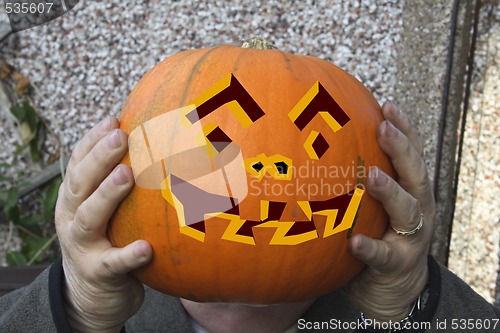 Image of large pumpkin with painted face
