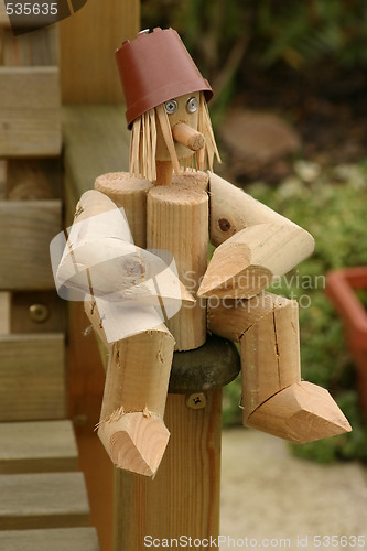 Image of wooden log man