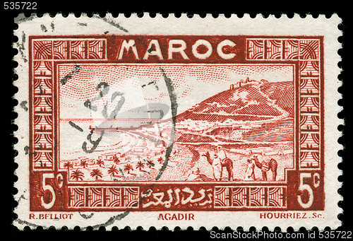 Image of vintage stamp from Morocco depicting a traditional scenic view