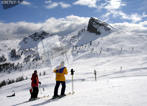 Image of Skiing couple admiring the nature