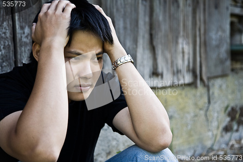 Image of Stressed asian male