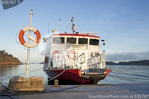Image of Lifebuoy and a moored ship
