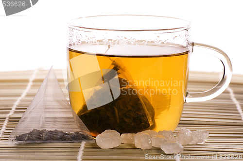 Image of white tea, nylon tea-bag and sugar