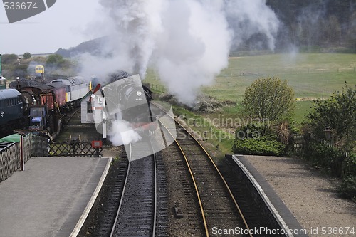 Image of locomotive entering a station