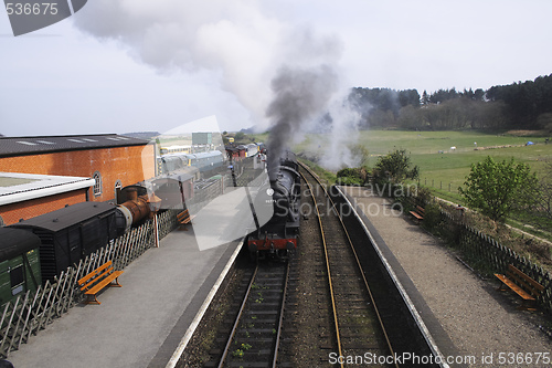 Image of locomotive entering a station