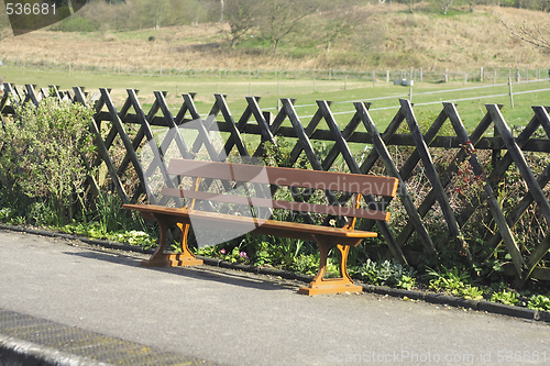 Image of wooden bench on a station