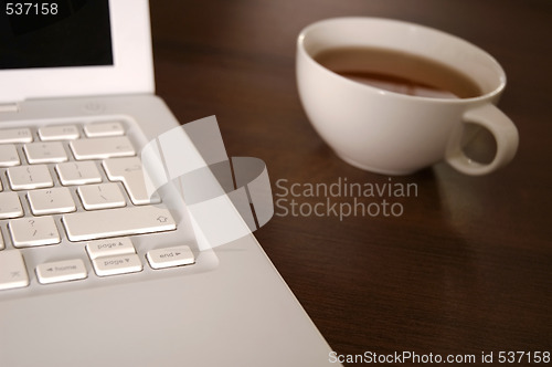 Image of laptop and tea cup