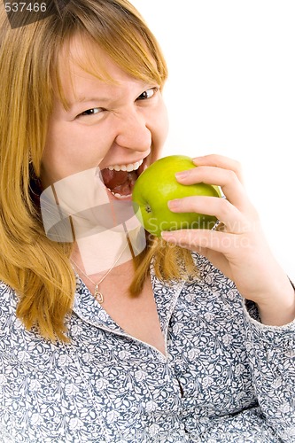 Image of young woman eating apple