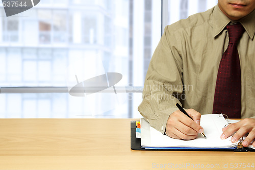 Image of Working businessman at office