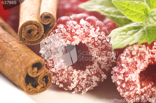 Image of sweet raspberries, cinnamon and fresh mint