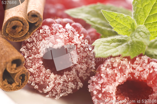 Image of sweet raspberries, cinnamon and fresh mint