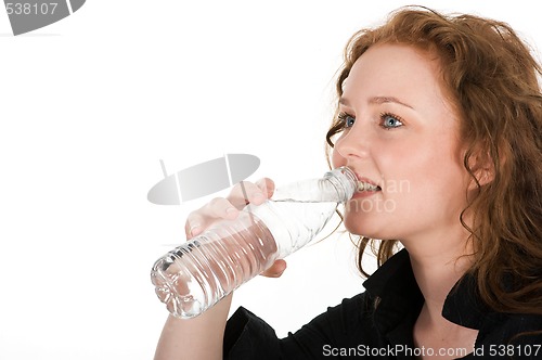 Image of Young woman drinking mineral water 