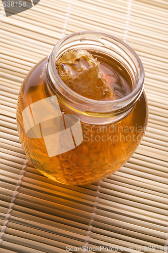 Image of fresh honey with honeycomb