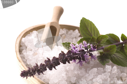 Image of aroma bath. sea salt and basil with flowers