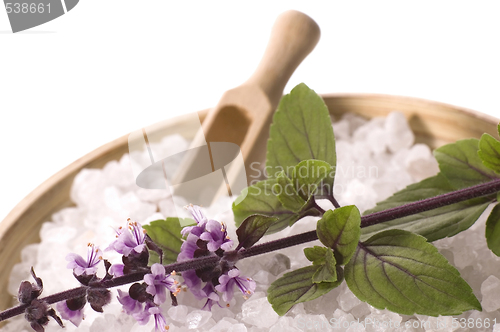 Image of aroma bath. sea salt and basil with flowers