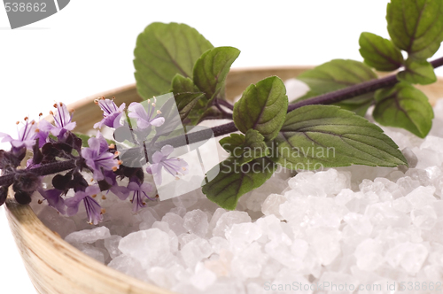 Image of aroma bath. sea salt and basil with flowers