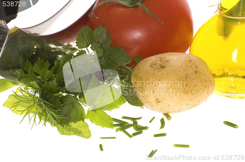 Image of cut fresh herbs and vegatables