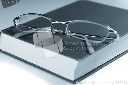 Image of book and glasses