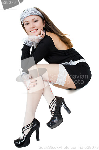 Image of Smiling sexy young maid. Isolated on white 