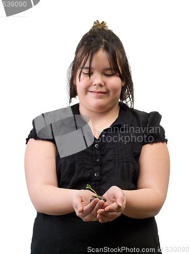 Image of Girl Holding Sapling