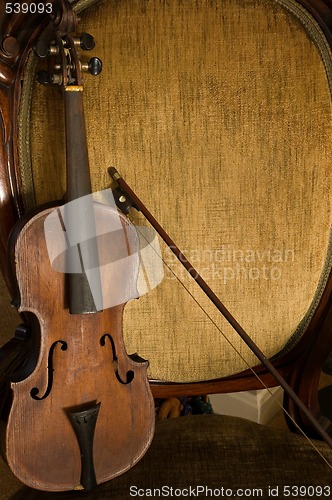 Image of Antique Violin, Bow, And Chair