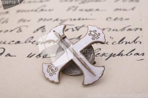 Image of Russian soldier cross on old manuscript background