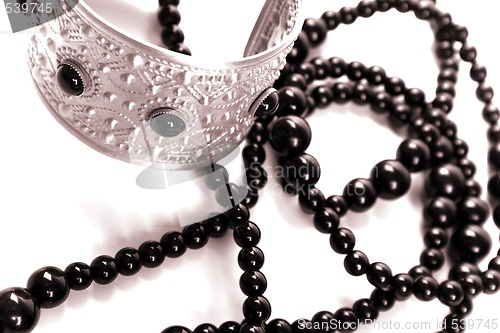 Image of bracelet and black necklace