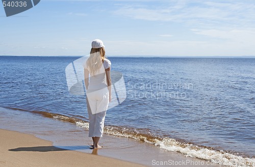 Image of Young woman looking at water