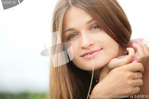 Image of girl with straw in mouth