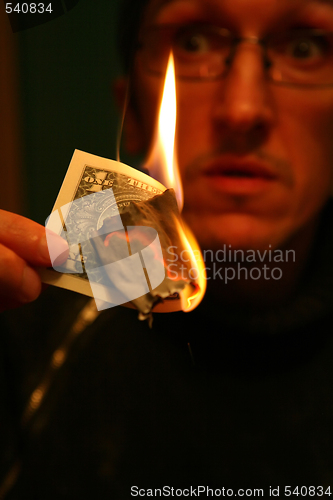 Image of Dollar in Fire