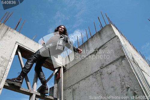 Image of man in black leather cloth