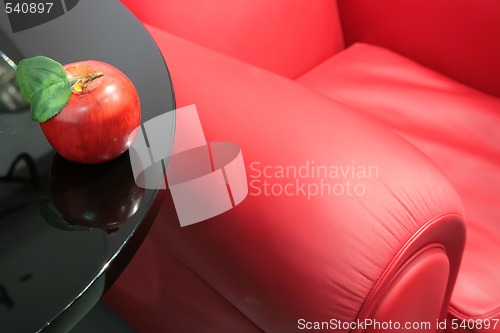 Image of red apple and a red easy chair