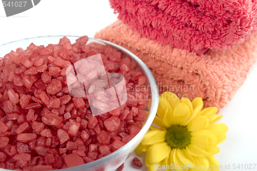 Image of bath salt, towels and flower