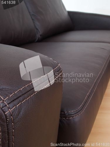 Image of Detail of brown leather sofa
