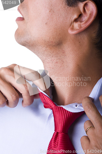 Image of adjusting the necktie