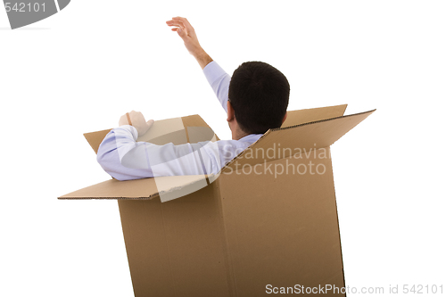 Image of businessman in a cardboard box