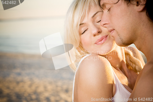 Image of Sensual couple on the beach