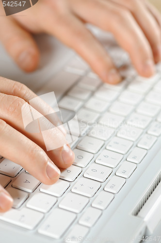 Image of male hands typing