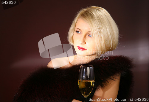 Image of Portrait of beautiful woman with glass champagne