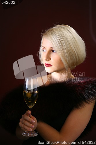 Image of Portrait of beautiful woman with glass champagne