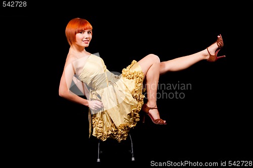 Image of Sexy redhead in yellow dress