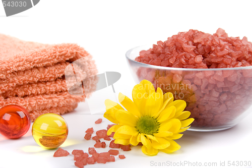 Image of bath salt, towels and flower