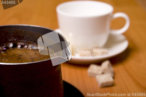 Image of coffee-maker, cup and sugar