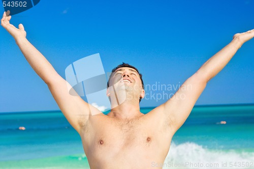 Image of happy man on the beach