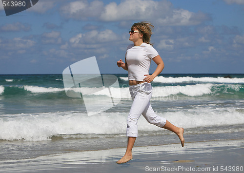 Image of Running woman on the beach