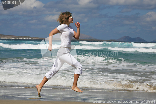 Image of Running woman on the beach