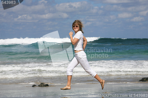 Image of Running woman on the beach