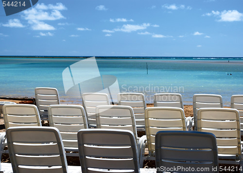 Image of Chairs at a hotel in front of a tropical beach in Brazil