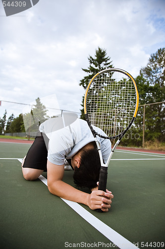 Image of Sad tennis player after defeat