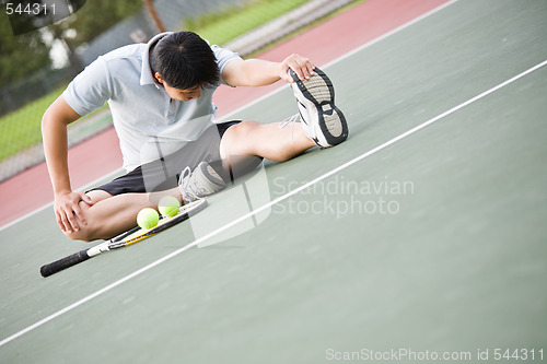 Image of Asian male tennis player